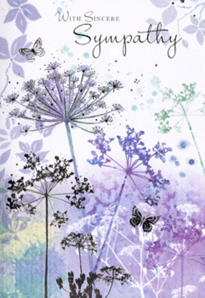 There is a contemplative calm in this sympathy card's illustration, the kind of gentle quiet you might notice looking out over the open spaces around Luton as the day first begins. The foreground is filled with slender, almost calligraphic stems of wildflowers, each topped with a distinctive umbelliferous head. These clusters are painted in intricate, lace-like patterns, yet the watercolour technique keeps the forms light and airy, never heavy. The colour scheme is a soothing harmony of violet, lavender, indigo, and soft blue, with occasional touches of silvery green that hint at surrounding grasses or distant leaves. Pigment has been allowed to pool and fade, creating soft edges that bleed into one another, so the flowers seem to emerge from a gentle haze rather than stand apart as rigid shapes. Between the stems, negative space has been used thoughtfully, echoing the sense of openness one might feel in Wardown Park or along the outskirts of Stopsley on a quiet afternoon. Transparent butterflies hover among the blooms, their gossamer wings shaded with diluted purples and blues, evoking transformation, remembrance, and the subtle nearness of those who have passed. The background itself is a layered wash, shifting from light lilac at the top to cooler blues and greens below, like a softly clouded sky reflected over distant fields. Everything about the composition encourages unhurried reflection; it does not demand attention, but gently holds it. At Flower Delivery Luton, this is the sort of card we'd pair with a simple, elegant sympathy bouquet for services in and around the town-a design that acknowledges deep loss while offering a quiet place for the heart to rest.